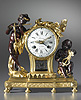 A rare Louis XVI patinated and gilt bronze mantle clock of eight day duration, signed on the white enamel dial Lacan à Paris